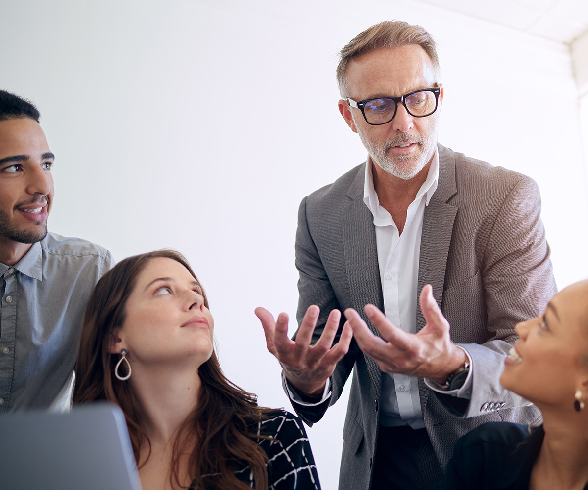 Business owners and leaders in a working session around a table